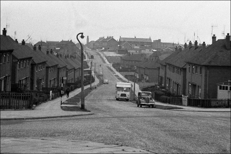 looking down Dawlish Drive towards the 'top shops' - in the middle is the tower of St. Stephen's Church  