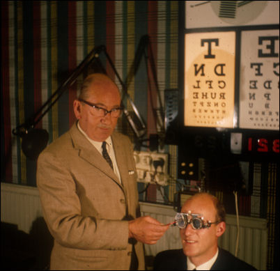 Fred Clarke at his work as an optician