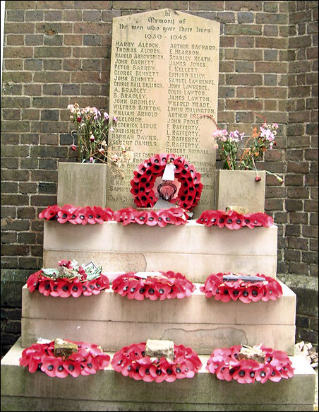 Poppies laid on Remembrance Sunday at the World War II memorial at the Church of St. John, Goldenhill 