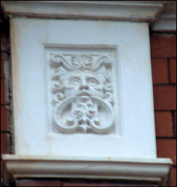 'Green Man' decoration in the eaves of the Old Swan Inn 