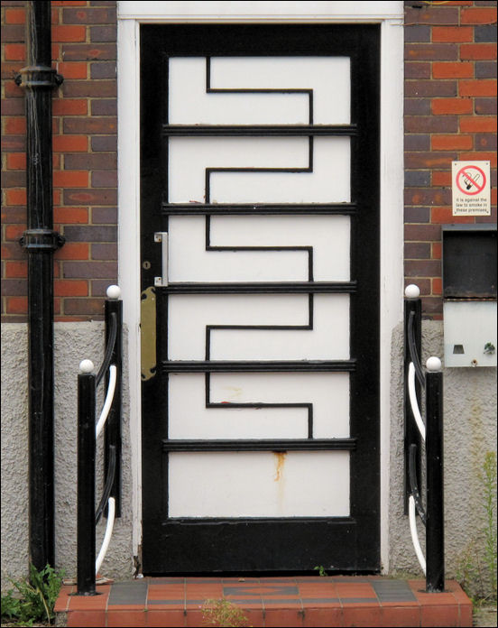original doors with geometric design and curved handrails 