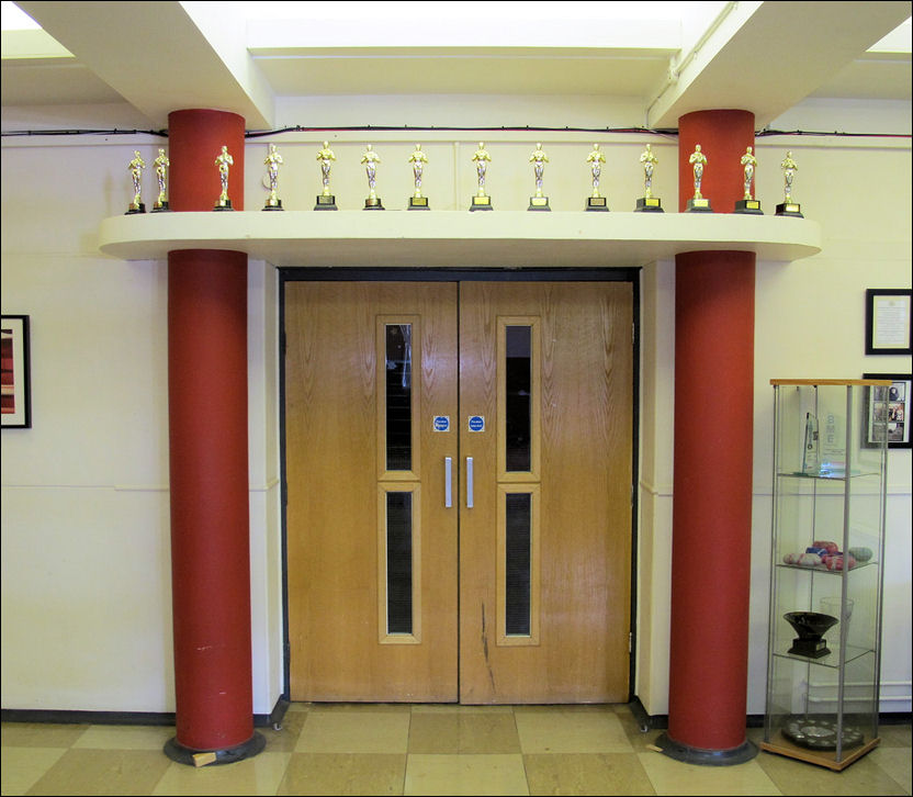 doors to the main hall - side columns and overhanging canopy frame the door
