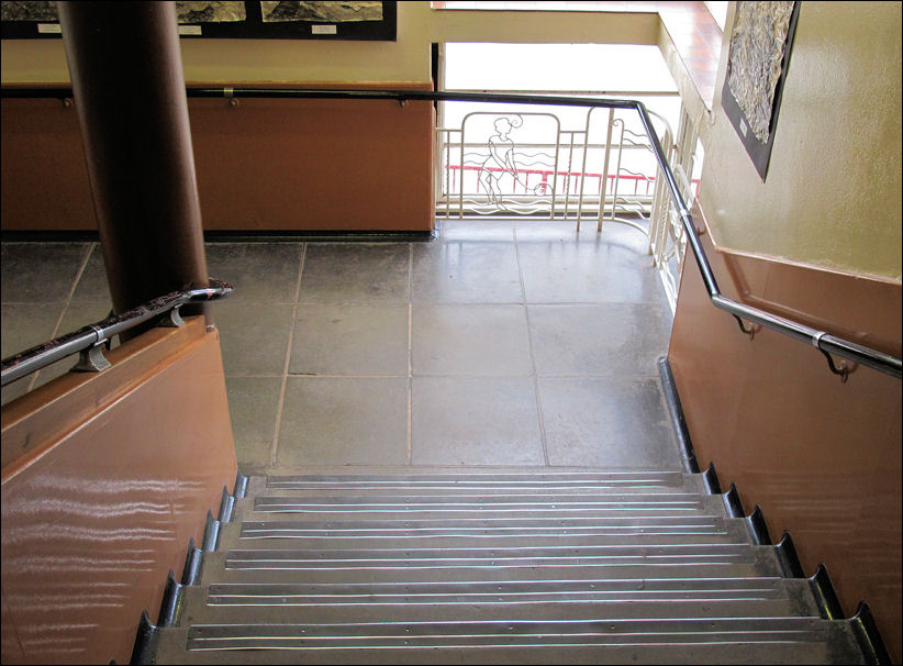 on the first floor landing a feature is made with ironwork figures