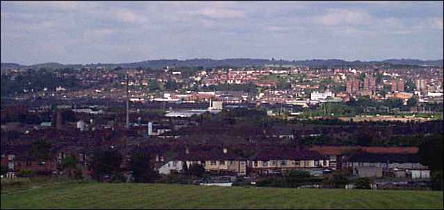 In the distance the Lyme Valley around Newcastle-under-Lyme, in the centre is Stoke and to the centre right are flats near Honeywall 