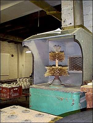The fired biscuit ware is brushed to remove small bits of adhering clay