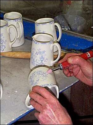 Decorated ware is fettled 