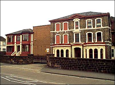 'Richmond Villa' to the left and 'The Hollies' to the right
