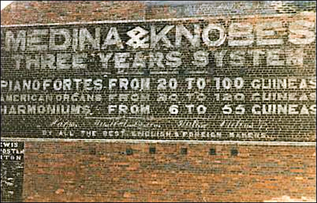 Wall advert from Glebe Street - advertising Medina & Knobes Pianofortes