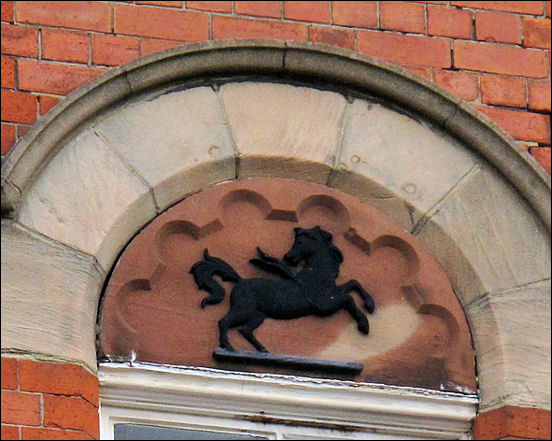 the Black Horse - the symbol of Lloyds Bank is still retained above the window in the upper floor