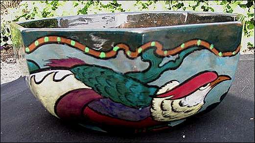 The bowl measures approximately 8 3/4 inches at it's widest and 4 inches high. 
