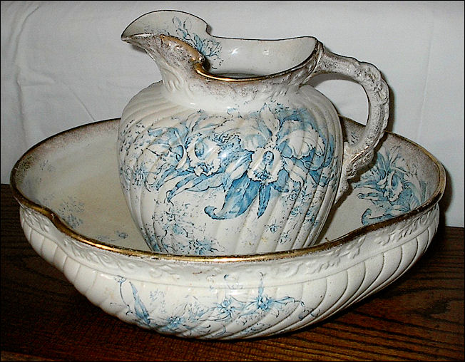 A Whittaker and Heath wash set jug and basin in the  "Florian" pattern