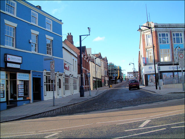 on the left is a letting agent and restaurant - Bennett's Steam Printing Works