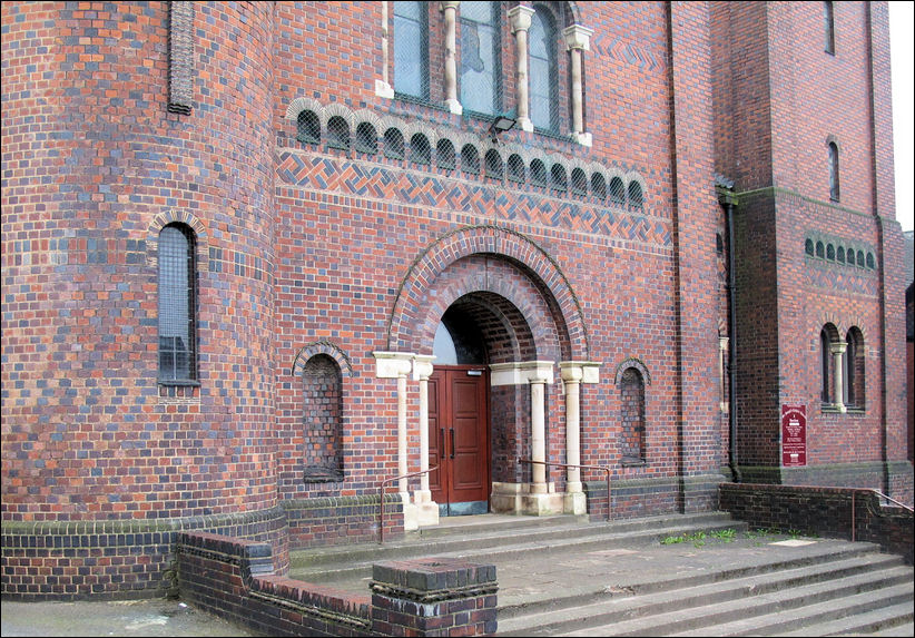  Designed in a Romanesque style by J. S. Brocklesby, it is of red and purple brick
