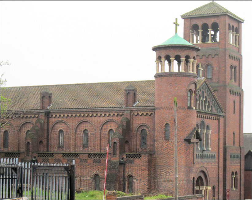 The two west towers of St. Joseph's ; one square in plan and one smaller and round, reflect those of the Sacred Heart in Tunstall