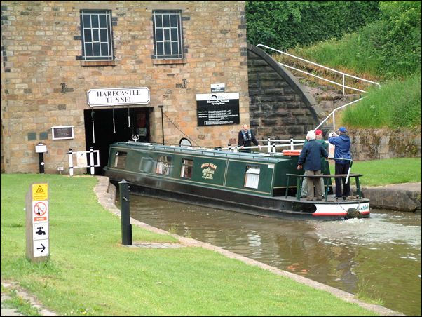 narrow boat entering the Telford tunnel portal at Harecastle on the Trent and Mersey Canal