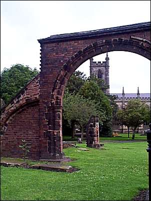 The pier base of the earlier church can be seen through the arch