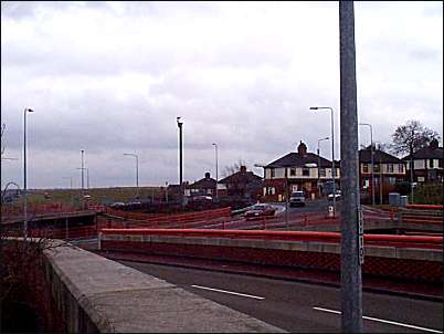 View of the A50 slip road / Blurton Road roundabout from Tweed Street