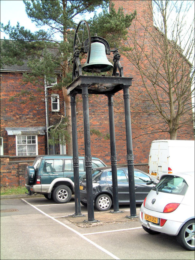 The bell in the car park at the rear of the Holy Trinity Church, Newcastle-under-Lyme