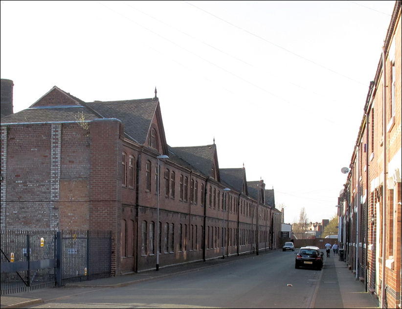 from Port Street - the frontage of the works dominates the housing 