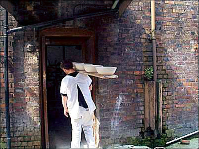 The manager would have seen workers  carrying ware into the kiln area to be fired