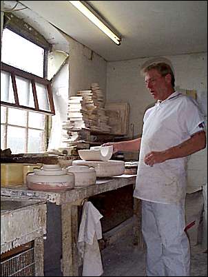 The mould maker with plaster of paris mould halves.