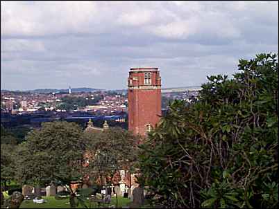 through the trees to the right is the tower of Fenton Cemetery