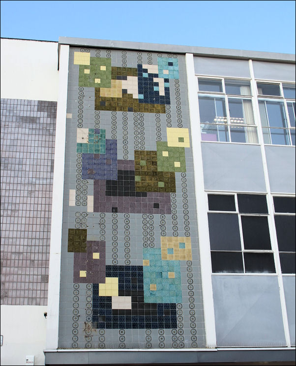 the attractive full-height exterior ceramic panel, its abstract design based on squares